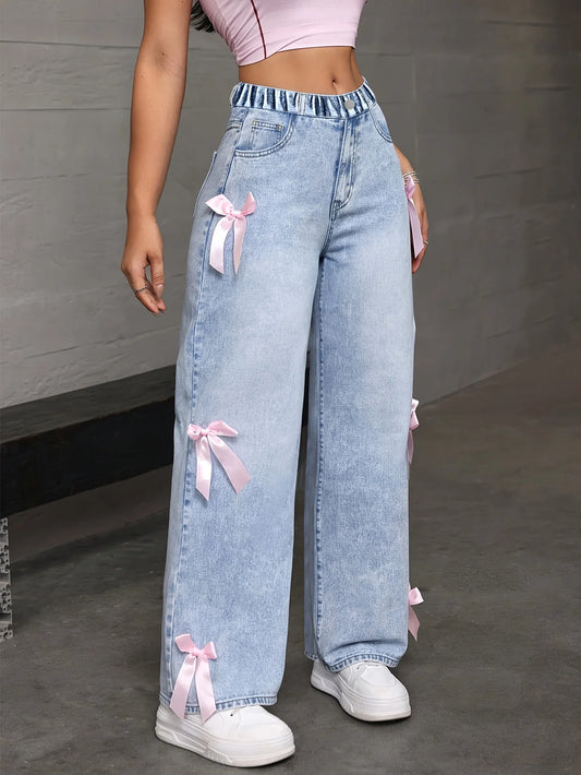wide-leg jeans with pink side bows.